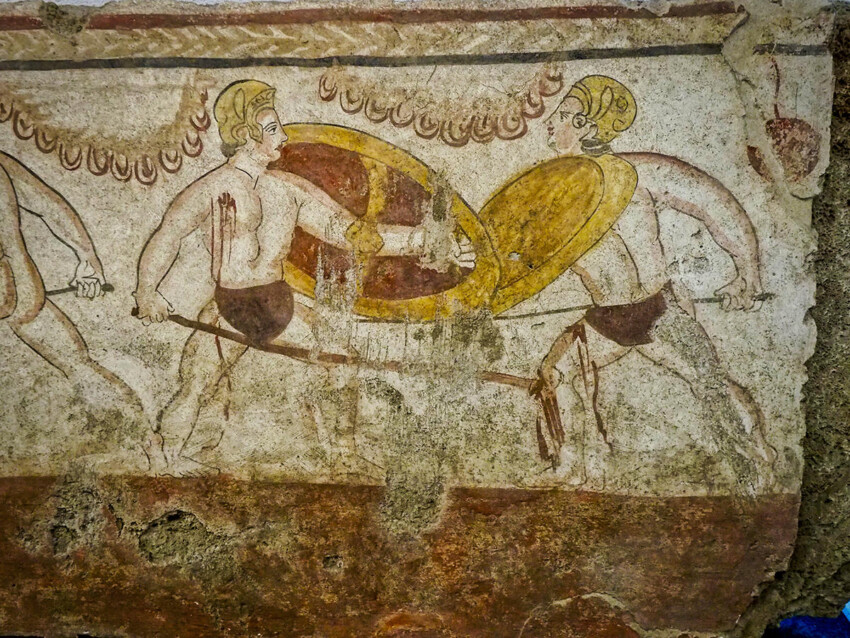 Policromia en losa de una escena de lucha entre guerreros hoplitas museo de Paestum